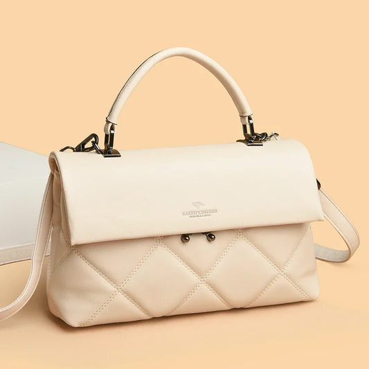 White quilted handbag with a visible brand logo on a beige background